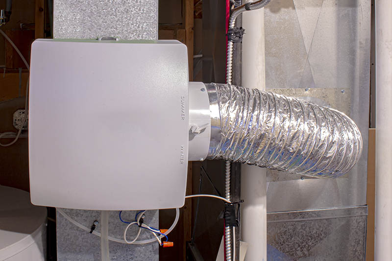 A home humidifier attached to the return duct with a bypass connection to the supply hot air duct. A home humidifier attached to the return duct with a bypass connection to the supply hot air duct.