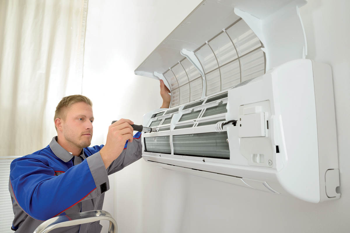 technician servicing a mini-split