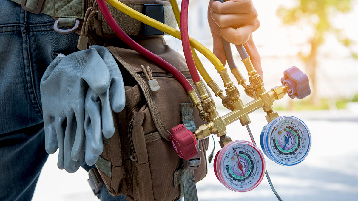 HVAC technician wearing work belt
